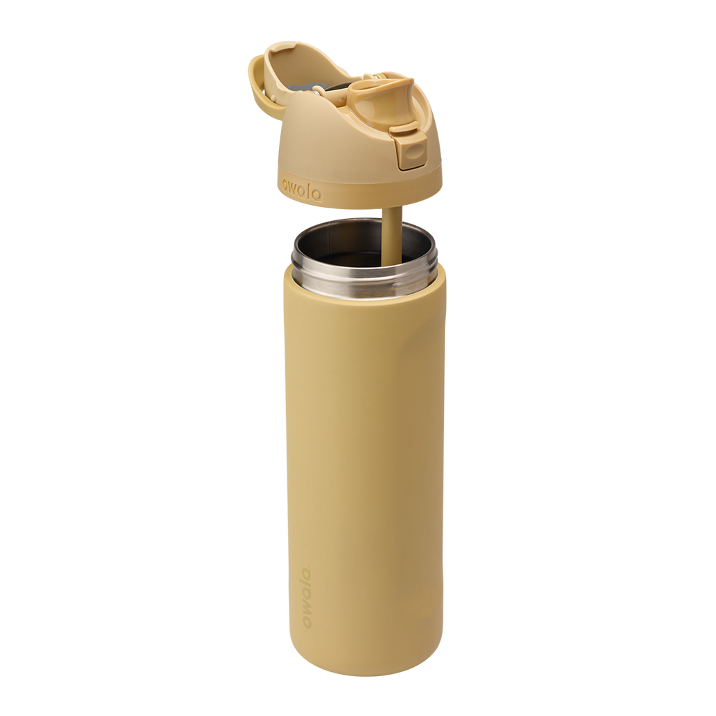Owala FreeSip 24oz in Autumn Vista, exploded view showing warm honey-sand insulated stainless steel body separated from matching flip cap with carry loop